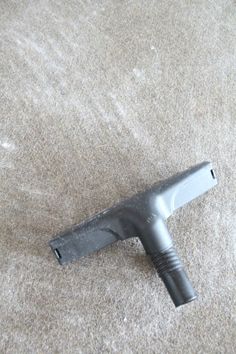 a metal object laying on top of a carpet