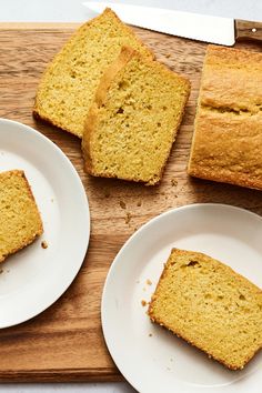 slices of banana bread on plates next to a knife