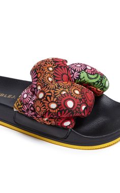 Classic pool slides meet maximalism in these fab-u-lous slip-ons. Ideal for your next sunny getaway or swapping out your old house shoes, these babies feature a moulded footbed and a padded braided strap crafted from silky twill in our most vibration-raising prints. Do as J.J. does and wear with the jazziest socks you can find. Padded silky twill braided strap Moulded footbed 100% Made in Italy Composition: 53% Polyurethane 30% Polyester 17% Suede Lining Yellow Beach Slides With Rubber Sole, Comfortable Multicolor Slide Sandals, Multicolor Cushioned Slides For Spring, Multicolor Non-slip Slip-on Slippers, Multicolor Synthetic Round Toe Slides, Comfortable Multicolor Slides For Vacation, Multicolor Non-slip Slip-on Slides, Multicolor Non-slip Slides, Multicolor Slip-on Beach Slides