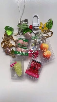 various charms and key chains on a white surface