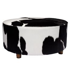 black and white cow print ottoman with wooden legs