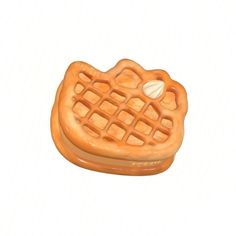 an orange waffle shaped object with a shell on it's side, sitting in front of a white background