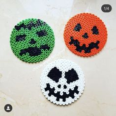 three halloween coasters made out of perler beads