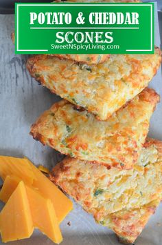 cheddar scones are stacked on top of each other with cheese next to them