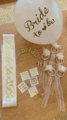 the bride to be balloon is next to other decorations and accessories on a table top