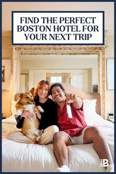 a man and woman sitting on top of a bed with a dog