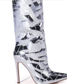 The RENAISSANCE TOUR Shattered Metallic Stiletto Boot In Silver features a faux suede upper, a thigh high shaft, a slim stiletto heel, a pointed toe silhouette, and an inner ankle zipper closure. Complete with reflective metallic crackle detailing throughout. Walk with the stars in these luxurious Shattered-Silver Stiletto Boots, crafted with a sleek, pointed toe and eye-catching shattered glass pattern. Fit for a diva, these over the knee boots are sure to make a statement with their shimmering Stiletto Boots, Stiletto Pumps, Long Boots, Shoe Closet, Black High Heels, Long Legs, Thigh High, Stiletto Heel, Thigh Highs