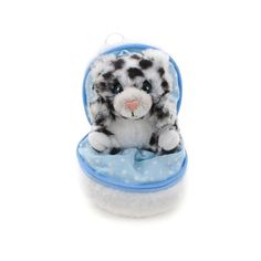 a small stuffed animal sitting inside of a blue case on a white background with snowflakes