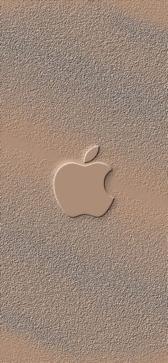 an apple logo is shown on the sand