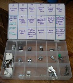 a plastic box filled with lots of different types of sewing tools and hardware on top of a wooden table