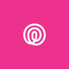 the letter q in a circle on a pink background