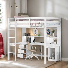 a white bunk bed with desk and chair in a room next to a christmas tree