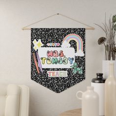 a banner hanging on the wall that says mrs and msy teach with school supplies