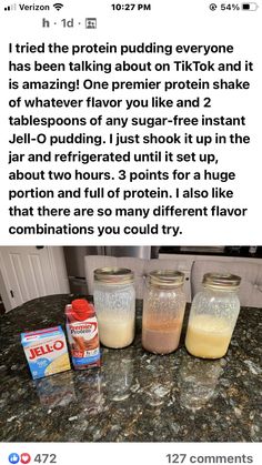 three jars filled with liquid sitting on top of a counter