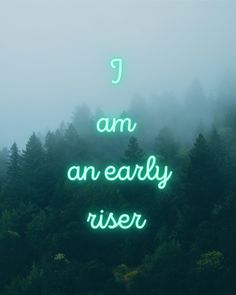 a green neon sign that says i am an early riser in front of some trees