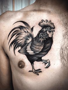 a black and white rooster tattoo on the chest