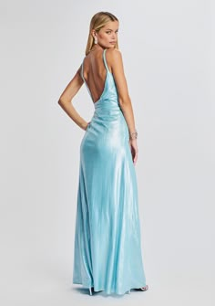 Embrace your inner goddess in our Yesi Dress! Crafted in lustrous lamé, this silhouette features ruched panels on the bodice and a maxi-length skirt. Barely-there straps and a thigh-high side slit provide the silhouette with a seductively feminine feel. The style is finished with an invisible side zip closure. Shown here in Blue Silver. 95% Polyester, 5% Spandex Made in China Model size XS is 5'11" wearing size XS Model size L is 5'11" wearing size L Style No. PF22-5193 Prussian Blue Dress, Light Blue Long Dresses, Iridescent Dress Prom, Cute Simple Prom Dresses, Mamma Mia Inspired Prom Dress, Aquamarine Prom Dress, Powder Blue Prom Dress, Aqua Formal Dress, Silk Light Blue Formal Dress