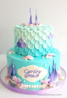 a blue and purple cake with an under the sea theme on it's side