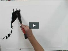 someone is using scissors to paint a horse's head on a white sheet of paper