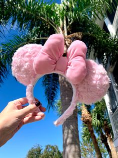 "Much like our purple fluffy ears, these millennial pink fluffy ears are a cotton candy dream. The bow is designed in our unique Minnie Mouse style and made from a shimmering satin pink material. The inside of the headband is stitched with a non-slip velour so your ears will remain both secure and comfortable on your head all throughout your magical journeys. You can find all our fluffy ears options available in our Fluffy Mouse Ears Collection - - - Headbands are one size fits most. Both ears a Almond Pearl Disney Ears, Disney Land Headband, Disneyland Ears, Diy Disney Ears, Disney Ears Headband, Diy Mickey Ears, Disney Mouse Ears, Disney Minnie Mouse Ears, Disney Headbands