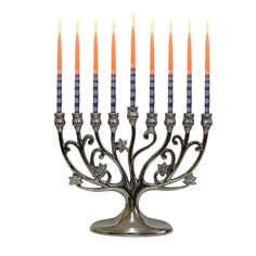 a silver menorah with five candles on it's side and an orange candle in the middle