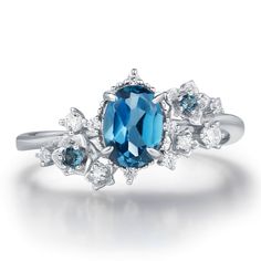 Wrap your love in the mystique of the night with our Midnight Veil London Blue Topaz Ring. This captivating piece features a deep, dazzling oval London blue topaz right at the center, surrounded by a sparkle of white gems and extra pops of London blue topaz accents within the gorgeous floral patterns that resemble a moonlit garden in full bloom—so romantic and whimsical! Celebrate your unique love with a ring that’s as extraordinary as you are. ✦ Available in both 14K white gold vermeil (14K whi Moonlit Garden, Gold Vermeil Jewelry, London Blue Topaz Ring, Ring White Gold, Forever Jewelry, Vermeil Jewelry, Jewelry Ring Box, Agate Ring, Agate Necklace