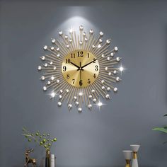 a clock that is on the wall next to a vase