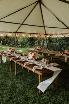 a long table set up under a large tent