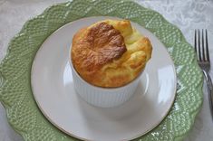 a muffin sitting on top of a white plate