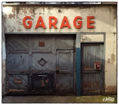 an old garage with two wooden doors and the word garage on it's side