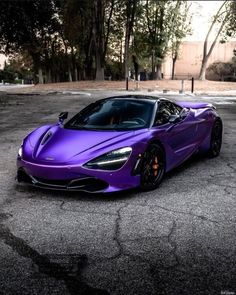 a purple sports car parked in a parking lot