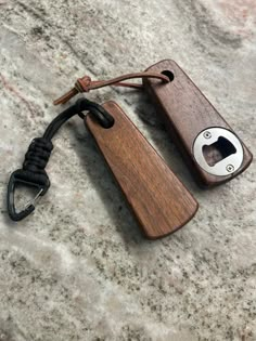 a bottle opener with a cord attached to it