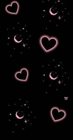 some pink hearts and stars on a black background