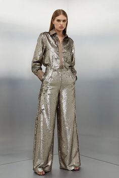 The ultimate party piece, these sequinned trousers are cut in a relaxed wide leg style to exude after-dark decadence. Make an instant statement and style this standout piece with the matching shirt and barely-there heels.TrousersSequinsHigh waistedWide leg Shiny Trousers Outfit, Rhinestone Pants, Rising Aesthetic, Sparkle Pants, Plus Size Workwear, Aquarius Rising, Nye Outfits, Eve Dresses, New Years Eve Dresses