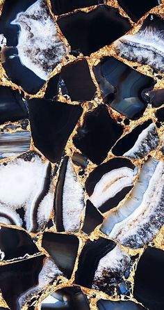 black and white marble with gold foiling on it's edges is seen in this close up photo