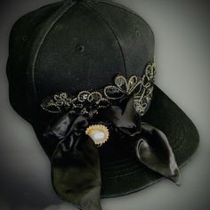 Black Baseball Cap/Hat ~ Decorative Elements Added / Satin Ribbon And Emblem / Pearl Button Fancy Embellished Hats / Hand Made By Liz / One Of A Kind Price: $25 Location: Punta Gorda Isles, Florida Size: One Size Fits Most Materials: New, Used, And Vintage Elements Artistically Combined Preowned Cotton Hat Ribbon Emblem Bow Pearl Button Lots Of Glue As An Interior Designer, I Have Accumulated Interesting "Spare Parts" Over The Years, So Decided To Utilize Them To Fabricate Hats, Jewelry, Decorat Embellished Hats, Vintage Elements, Cap Designs, Black Baseball Cap, Street Fashion Men Streetwear, Men Streetwear, Ball Caps, Cotton Hat, Decorative Elements