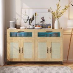 a wooden cabinet with glass doors and drawers in the middle of a room next to a lamp