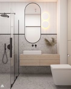 a bathroom with a sink, toilet and shower in it's center wall area