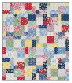 a patchwork quilt with different colors and patterns