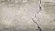 A building's foundation will crack eventually. As such, vertical foundation cracks are prevalent and not a real structural concern. Learn more here! Building Foundation, Foundation Repair, Decorative Plaster, Concrete Texture, Wall Background, Home Maintenance, Interior Design Trends, Inspired Homes, Wall Murals