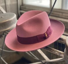 "This European style wide brim fedora features: * 4 1/2\" center dent crown. * 3\" raw edge brim. * Antique Rose Body & Burgundy Ribbon * Finished with a premium roan leather sweatband, a 1 1/2\" ribbon and a satin lining. El Capo is a beautiful, wide-brimmed fedora that is equal parts elegance and style. With roots in European design, the El Capo can be the perfect accessory for a sharp-dressed night out on the town. Additionally, El Capo is available in several different sizes to fit your spec Wide Brim Hat Men, Burgundy Ribbon, Rose Body, Elegant Hats