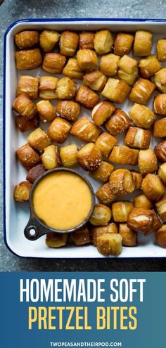 homemade soft pretzel bites in a baking dish with dipping sauce on the side