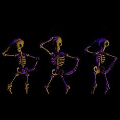 three skeletons are dancing in the dark