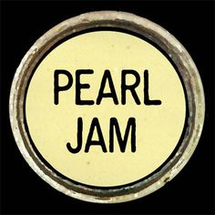 a button with the words pearl jam in black and yellow on it's side