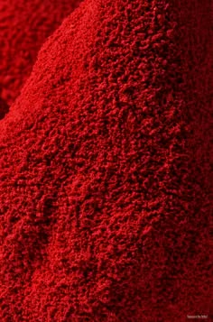 red powdered material is shown in close up