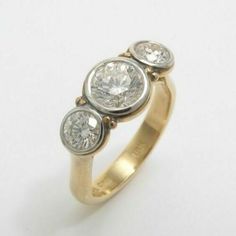 three stone diamond ring in yellow gold