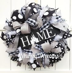 a black and white wreath with the word home on it