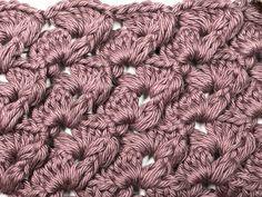 the crochet pattern is made up of pink yarn