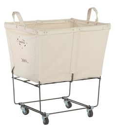 a shopping cart with two large canvas bags on the front and one smaller bag on the back