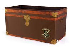 an old trunk with harry potter emblems and hogwart's crest on it